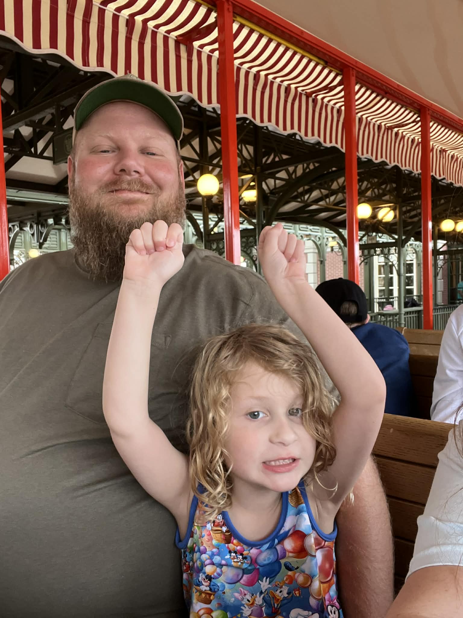 Dad and daughter riding the Walt Disney World Railroad